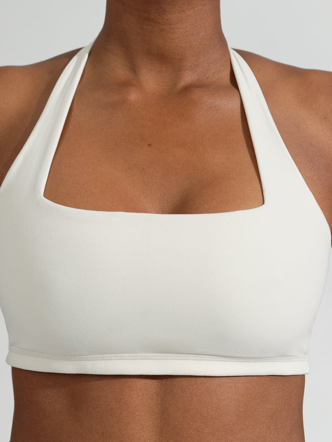 Buy TWISTED HALTER NECK WHITE SPORTS BRA for Women Online in India